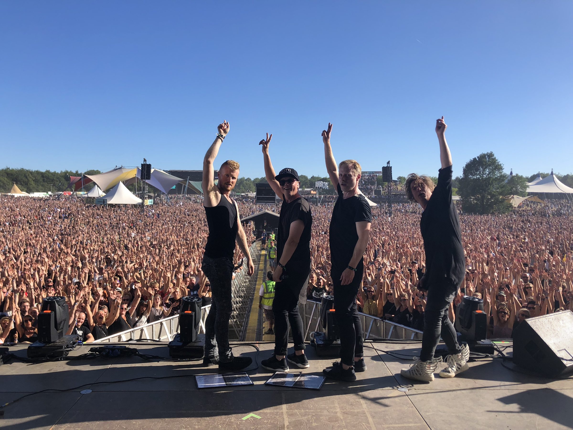 Carpark North on stage in front of a festival crowd